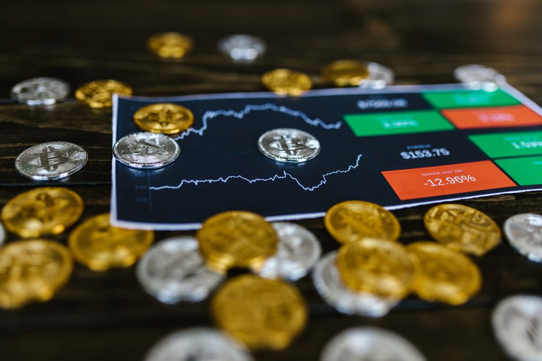 Crypto coins beside a live price chart